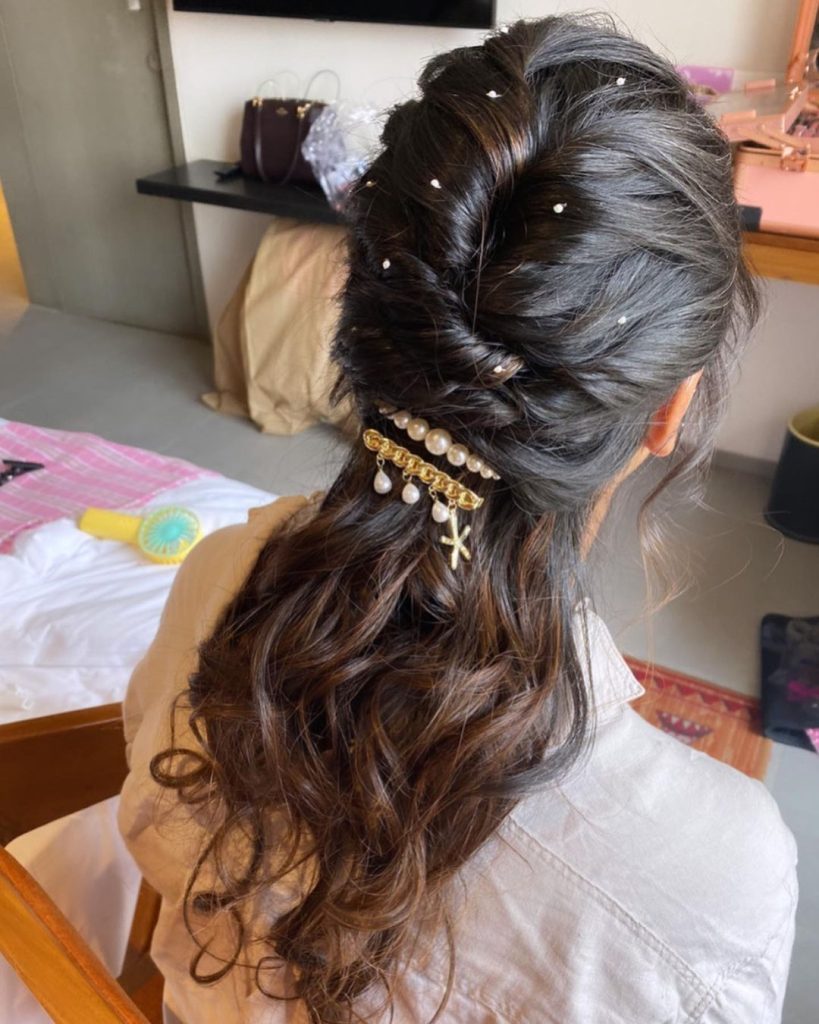 Photo of Sangeet lehenga with messy bun hairstyle