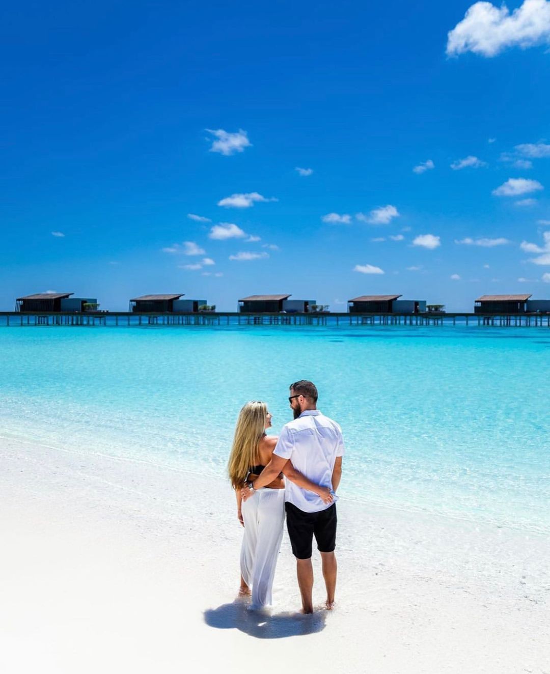 Photo of Pre wedding or honeymoon photo on the beach | Pre wedding  photoshoot beach, Couple photography poses, Honeymoon pictures